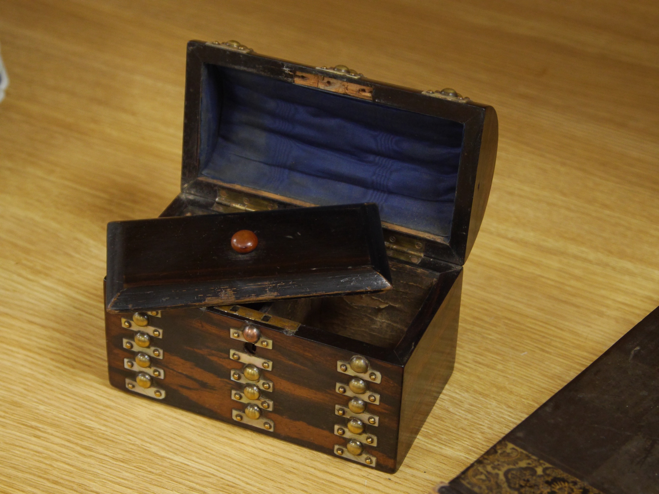 A late 19th/early 20th century Chinese lacquer chess board/box and a brass and mother of pearl mounted coromandel dome topped caddy, largest 49cm. Condition - fair